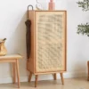Modular Step Cube Bookcase in cherry wood features flexible open storage, a stepped design and versatile display space for modern interiors. Manna oak entryway shoe cabinet featuring a woven rattan mesh door and umbrella hanging side hook in a home hallway.