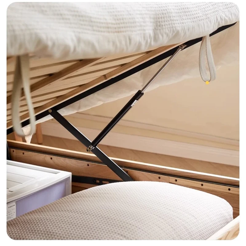 Durable steel hydraulic gas lift strut mechanism supporting wooden slatted mattress foundation.