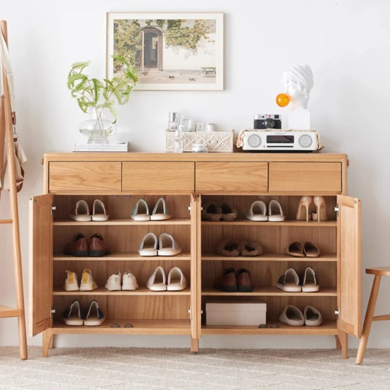 large-capacity-solid-wood-shoe-storage-cabinet-open Open view of natural wood 4-door shoe cupboard showing adjustable multi-tier shelves fully organized with footwear.