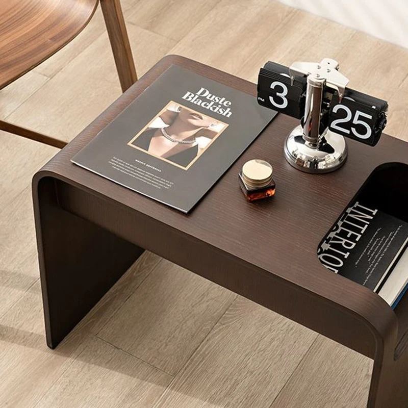 Top view detail of Manna dark walnut bentwood side table with a vintage flip clock, magazine, and magazine slot storage.
