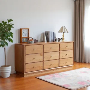 Manna cherry wood 9-drawer dresser credenza styled with a table lamp, wooden clock, and books in a bright room.