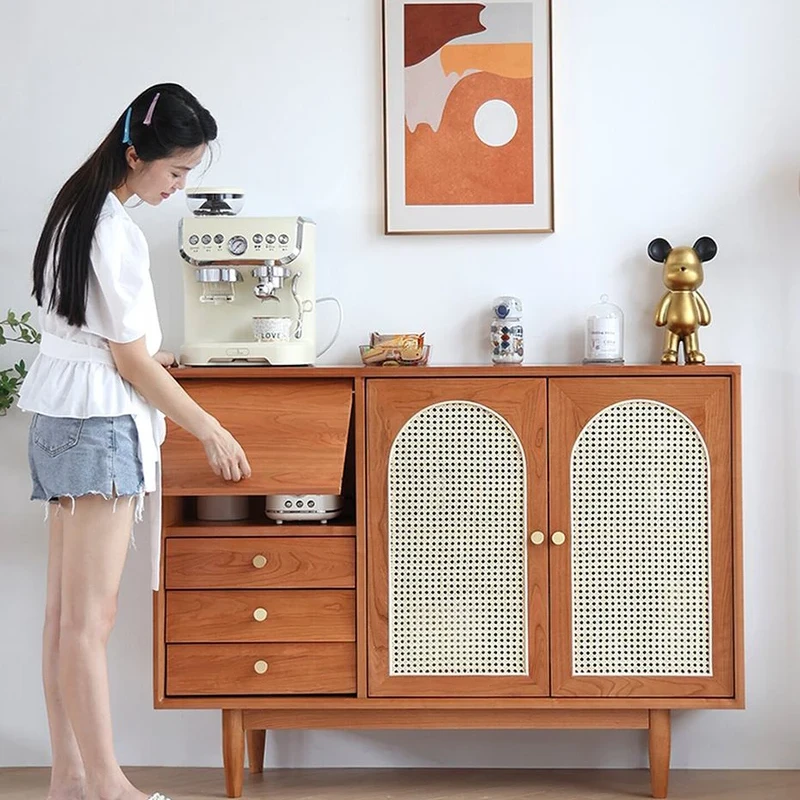 Manna cherry wood sideboard credenza with a person opening the flip-top storage compartment holding small appliances.