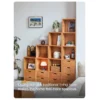 manna-cherry-wood-modular-step-cube-bookcase-living-room Manna cherry wood modular step cube bookcase set arranged in a staircase layout in a spacious living room.