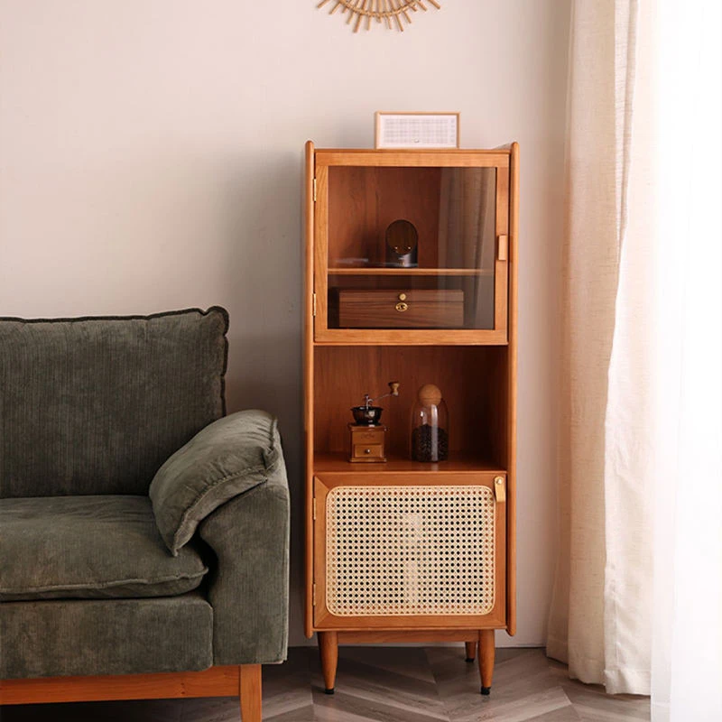 Front view of Manna cherry wood side cabinet featuring top glass display, middle open shelf with coffee grinder, and bottom rattan door.