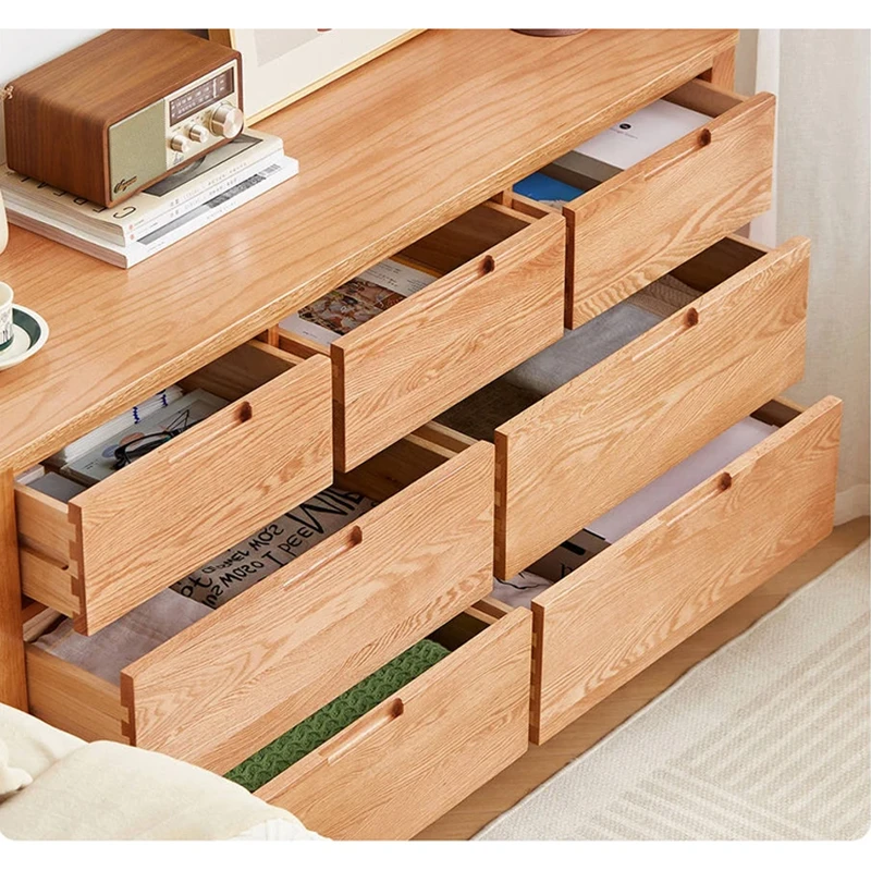 manna-oak-7-drawer-dresser-recessed-pulls-open-drawers High angle view of Manna oak 7-drawer dresser with all drawers pulled open, showing recessed handles and spacious organized storage.