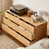 Top-down view of Manna oak 7-drawer wide dresser with all drawers pulled open showing organized clothing storage.