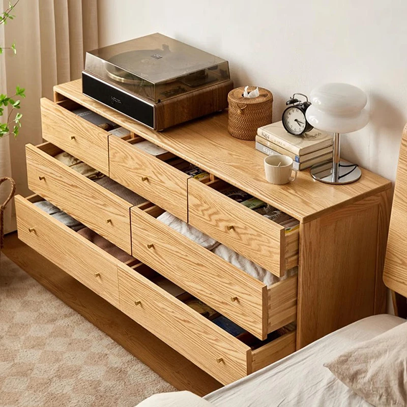 Top-down view of Manna oak 7-drawer wide dresser with all drawers pulled open showing organized clothing storage.