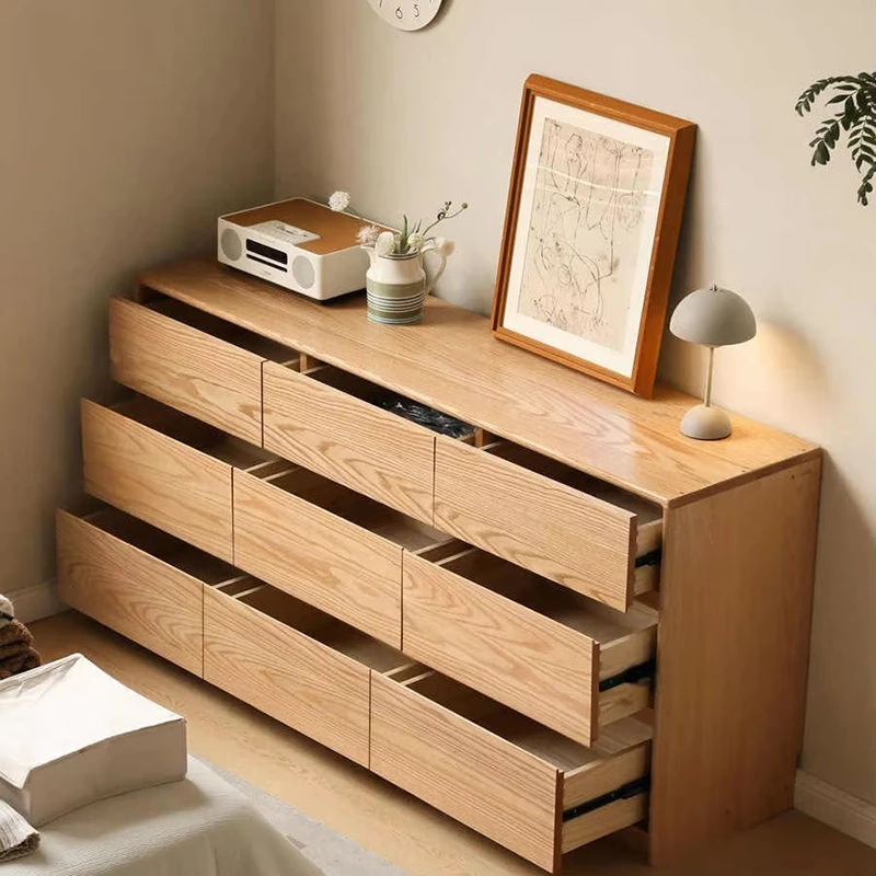 manna-oak-9-drawer-dresser-open-drawers-storage High angle view of Manna oak 9-drawer wide chest of drawers with open drawers showing spacious interior storage capacity.