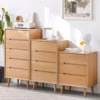 manna-oak-chest-of-drawers-3-4-5-tier-living-room Manna oak solid wood chests of drawers in 3-drawer, 4-drawer, and 5-drawer options arranged side-by-side in a modern living room.