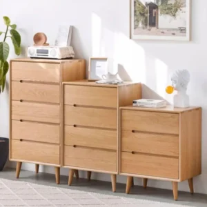 Manna oak solid wood chests of drawers in 3-drawer, 4-drawer, and 5-drawer options arranged side-by-side in a modern living room.