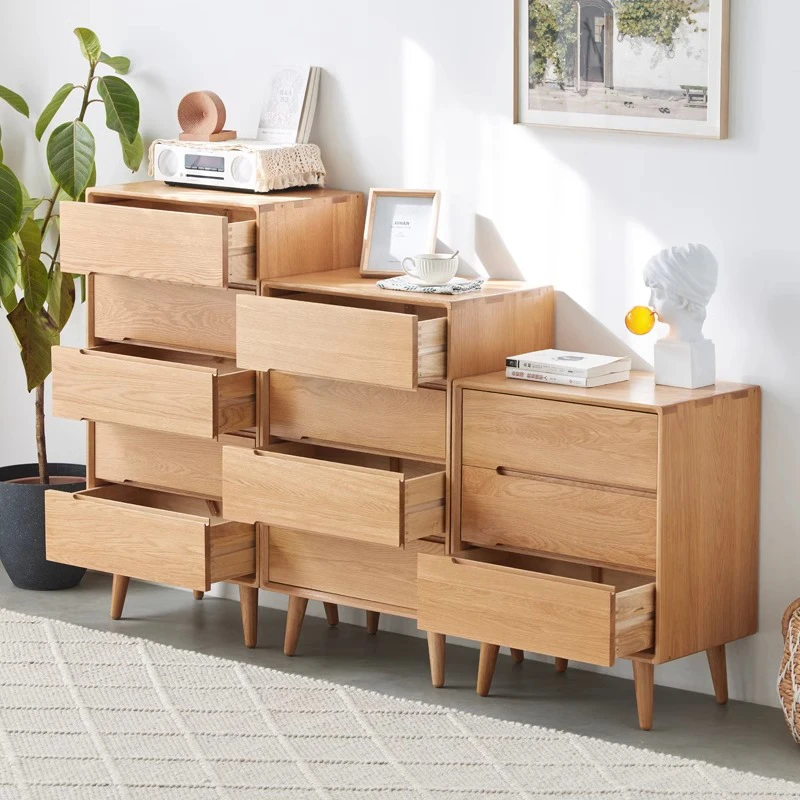 manna-oak-chest-of-drawers-open-drawers-storage-detail Manna oak chest of drawers set with open drawers showcasing spacious internal storage capacity and solid wood drawer box construction.