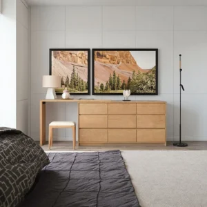 Manna oak 9-drawer dresser combined with an extendable vanity dressing table desk in a modern sunlit bedroom.