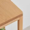 Manna oak minimalist open frame plant stands displayed in low, medium, and tall height options holding potted green plants.