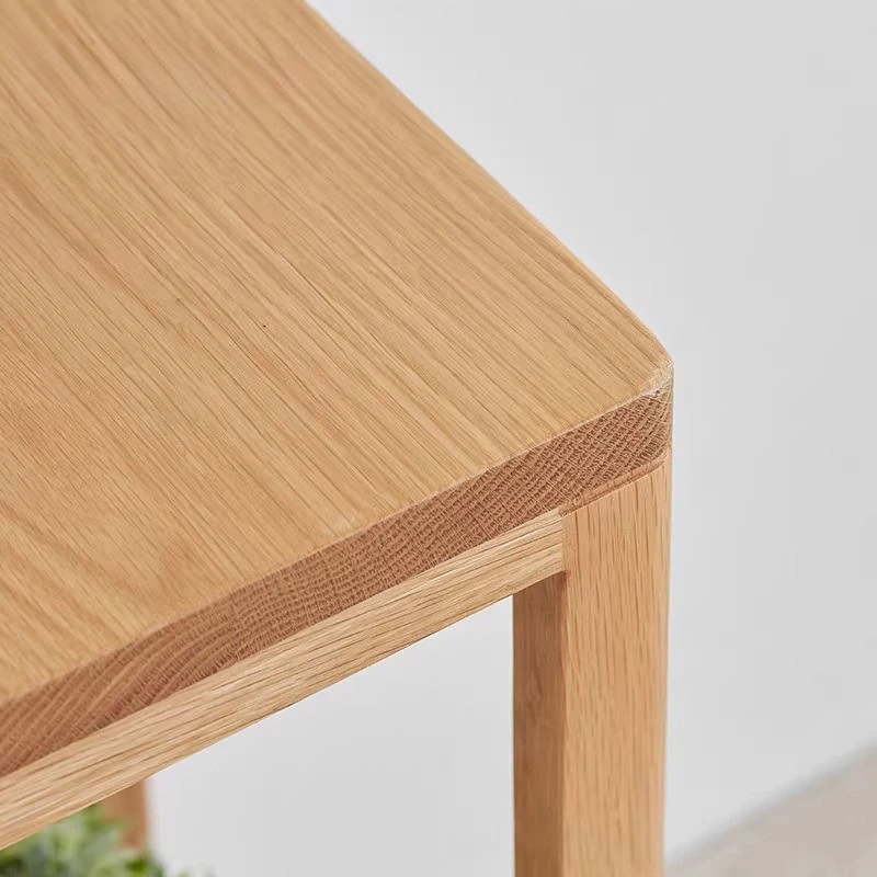 Manna oak minimalist open frame plant stands displayed in low, medium, and tall height options holding potted green plants.