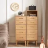 manna-oak-narrow-chests-front-view-comparison Front view comparison of Manna oak narrow 5-drawer chest and tall chest with open shelf holding books and a Bluetooth speaker.