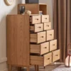 manna-oak-narrow-chests-open-drawers-storage-capacity Side-angle view of Manna oak narrow chests with all 10 drawers pulled open, demonstrating internal storage capacity.