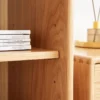 manna-oak-narrow-glass-display-cabinet-craftsmanship-detail Close-up detail of adjustable shelf pins, natural oak grain, and traditional dovetail joinery on Manna narrow glass display cabinet.
