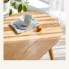 manna oak oval tabletop sunlight detail