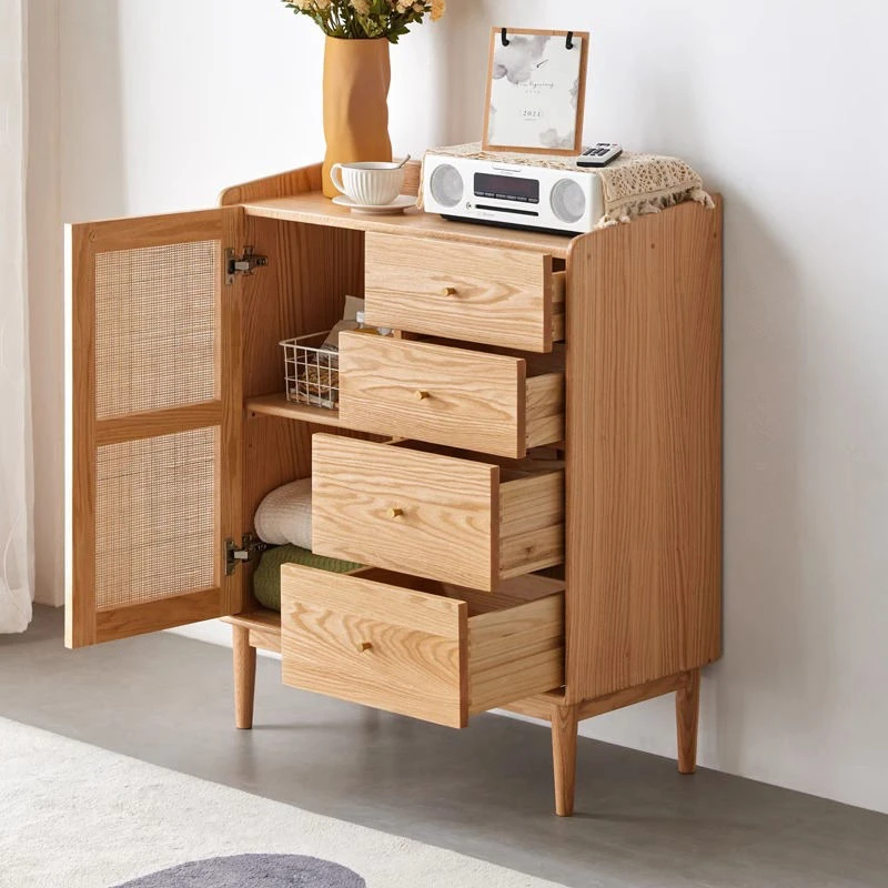 Close-up view of Manna oak cabinet with open rattan door and pulled-out drawers showcasing internal storage capacity.