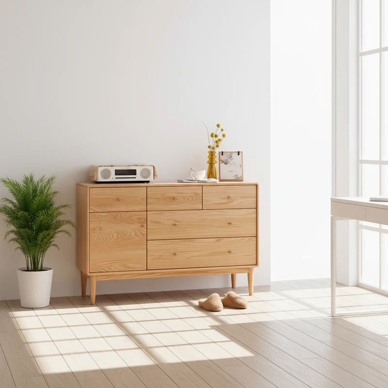 Manna oak sideboard credenza dresser styled in a bright, sunlit room next to a window and green indoor plant.