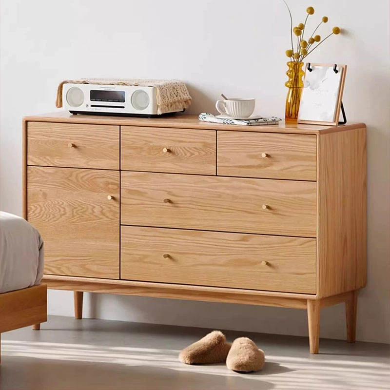 Manna oak multi-drawer sideboard credenza placed beside a bed as a spacious bedroom storage cabinet.