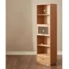 Front view of Manna oak narrow single door bookcase featuring open shelves, middle fluted glass compartment, and bottom drawer.