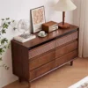 Top angle view of Manna black walnut 6-drawer dresser showcasing rich wood grain and decorative items on top.