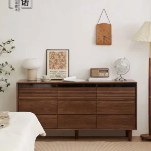 Front view of Manna imported North American black walnut 9-drawer dresser with top fluted wave design styled in a warm bedroom.