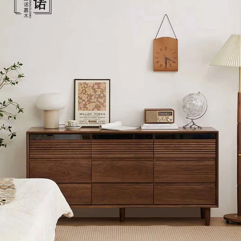 manna-walnut-9-drawer-dresser-fluted-wave-front-view-bedroom Front view of Manna imported North American black walnut 9-drawer dresser with top fluted wave design styled in a warm bedroom.