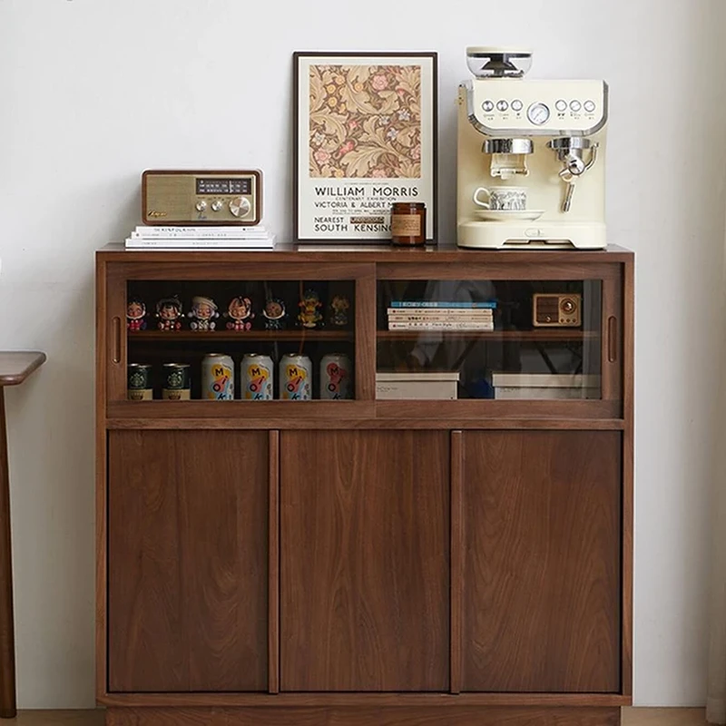 Front view of Manna black walnut credenza sideboard styled as a home coffee station with an espresso machine and radio.