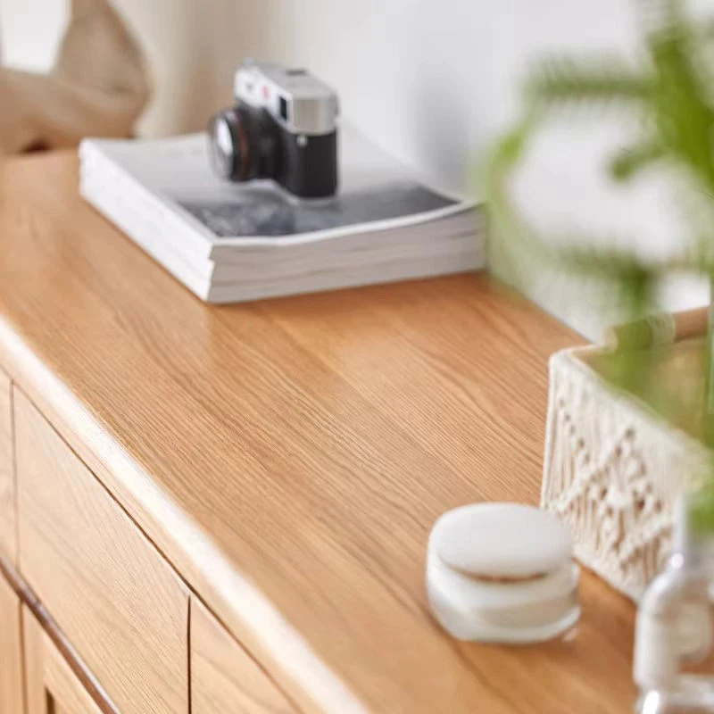 natural-oak-wood-grain-cabinet-top-detail Close-up view of natural oak wood tabletop surface displaying smooth rounded edges and distinct timber texture.