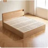 Solid wood box bed base with sturdy slatted mattress support and rounded modern headboard.