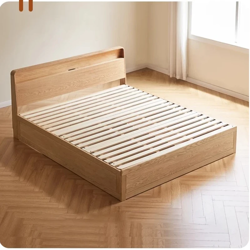 Solid wood box bed base with sturdy slatted mattress support and rounded modern headboard.