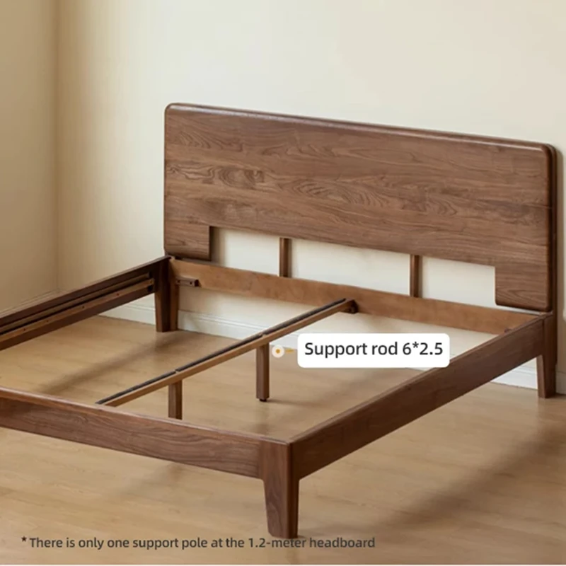 solid-wood-bed-headboard-storage-ledge-detail Close-up of solid walnut wood headboard featuring a rounded top ledge for resting glasses and small essentials.