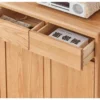 solid-wood-entryway-cabinet-drawer-storage Detailed look inside pull-out solid oak top drawer holding books, keys, and daily entryway essentials.