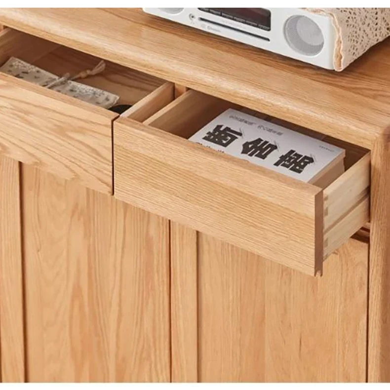 solid-wood-entryway-cabinet-drawer-storage Detailed look inside pull-out solid oak top drawer holding books, keys, and daily entryway essentials.
