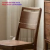 manna-black-walnut-dining-chair-curved-back-detail Detail view of a black walnut dining chair backrest showing the curved high back and a 104 degree angle.