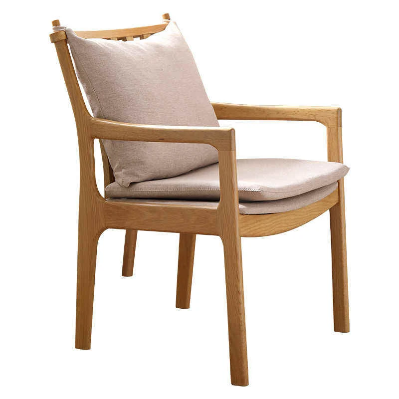 manna-oak-armchair-spindle-back-main Main view of solid oak dining armchair with curved armrests and removable beige fabric seat and back cushions.