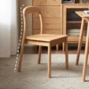 Detail view highlighting the curved open oak backrest of a dining chair with the outline marked in white dashes.