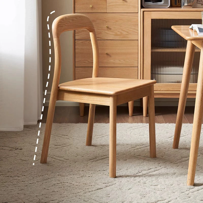 Detail view highlighting the curved open oak backrest of a dining chair with the outline marked in white dashes.
