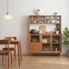 manna-oak-sideboard-glass-hutch-pendant-light-living-room Lifestyle view of an oak sideboard with fluted glass hutch doors in a dining room with a wooden table, chairs and a pendant light.