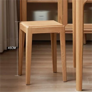 Solid oak square stool with a 45cm height marker standing on wood flooring beside a wooden cabinet and table.