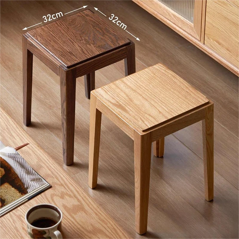 manna-oak-stool-size-guide Size guide showing two stackable square stools in walnut and oak finish with 32cm seat tops on a wooden floor.