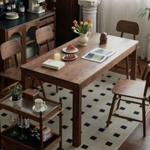 manna-walnut-rectangular-dining-table-with-serving-trolley-living-room Living room scene with a long walnut dining table, wood chairs and a two tier serving trolley on a dotted rug.