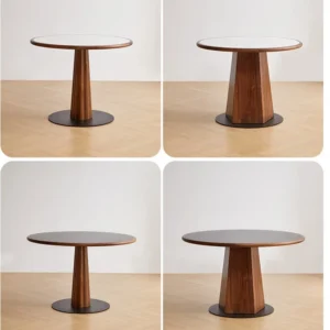 manna-walnut-round-dining-table-120cm-lifestyle Lifestyle scene of a round walnut dining table with a tapered base shown in four angles on light oak flooring.