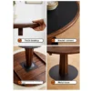 manna-walnut-round-dining-table-120cm-material-detail Material detail of a black top round walnut dining table showing thick desktop, round corners and metal base plate.