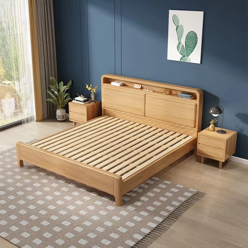 Beech platform bed with storage headboard and slatted base styled in a modern blue bedroom