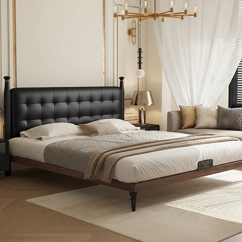 black-leather-tufted-headboard-walnut-platform-bed Walnut platform bed with black leather tufted headboard in a modern bedroom setting