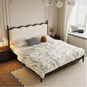 Black wood bed frame with cream wavy headboard in an elegant classic bedroom scene
