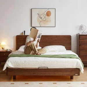 Black walnut bed frame with cream arched headboard in a warm lifestyle bedroom scene